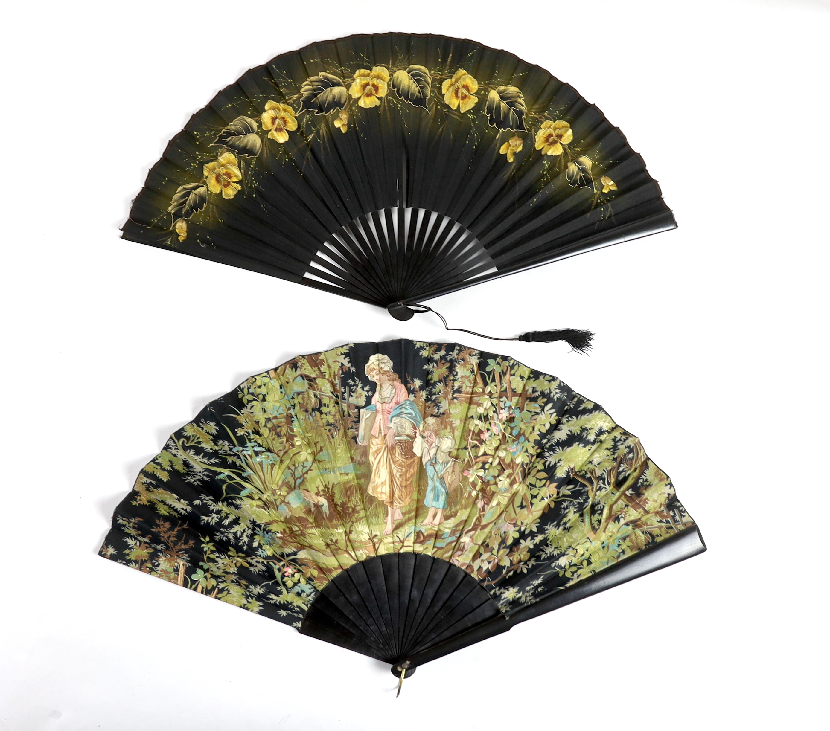 Two early 20th century ebony fans, one cotton leaf, the other hand painted pansies on a fine a silk leaf